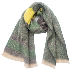 Close-up of soft knitted scarf featuring green and yellow leopard print patchwork patterns