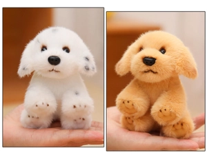 Close-up showing a mini spotted dog and golden retriever plush toy on a hand palm