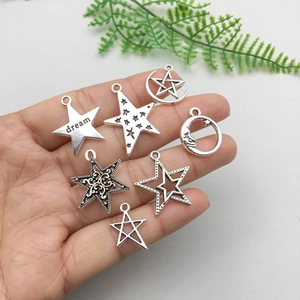 Antique silver star and moon charms set in various openwork designs for jewelry making