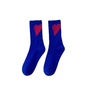 Blue cotton crew socks featuring a vibrant red heart pattern and ribbed elastic cuffs