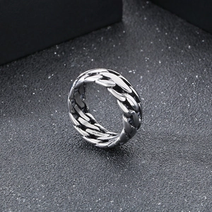 Macro shot of silver titanium steel chain link ring with polished punk vintage texture
