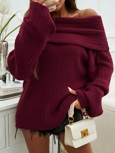 Detail of burgundy off-shoulder sweater showing thick knit texture and long sleeves
