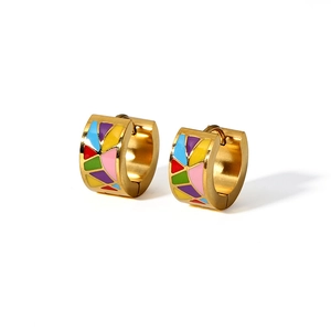 Detailed macro view of colorful mosaic enamel inlay on 18K gold plated hoop earrings