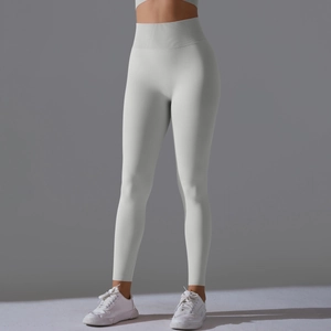 Detailed side view of light gray high-waisted seamless yoga pants with peach lift effect