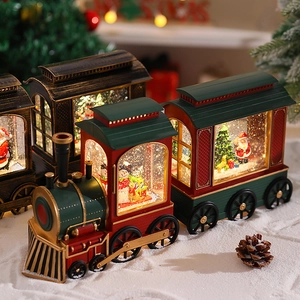 Detail of Santa Claus locomotive music box with LED snow scene and festive train cars
