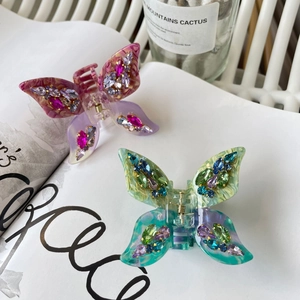 Elegant butterfly acetate hair claw clips with colorful rhinestones in pink and blue