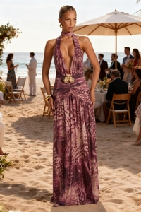 Detail of deep V-neckline and golden floral metal waist ornament on purple leopard dress