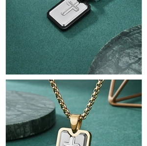 Detail of silver cross pendants with black and gold frames on elegant props