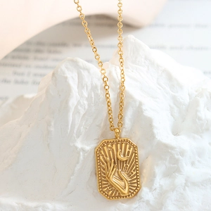 Gold titanium steel necklace featuring a square pendant with embossed hand and moon motif