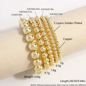 Five-piece set of gold-plated hollow copper bead bracelets in various sizes on a stand
