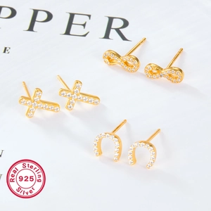 925 silver stud earrings set in gold with cross, infinity, and horseshoe cubic zirconia