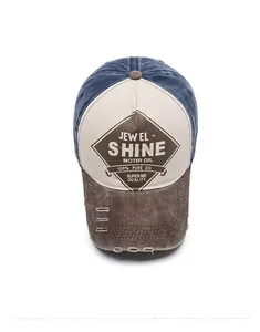 Top down view of vintage washed patchwork baseball cap with distressed brim and logo