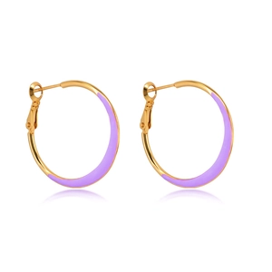 Macro shot of gold hoop earrings with purple enamel coating and S925 silver stamp details