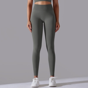 Detail view of high waisted dark grey-green yoga leggings with seamless ribbed waistband texture