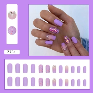 Matte purple glitter press-on nails set with rhinestones in gradient taro violet hue