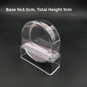 Clear acrylic jewelry display stand with arched cover showing a silver bracelet