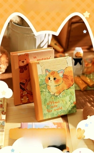 Cozy A7 notebook with cute kitten and bear illustrations in a warm, healing style