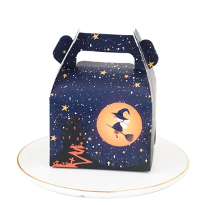 Halloween paper cake box with handle featuring cartoon witch and starry sky on white plate