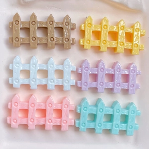 Detailed view of colorful resin fence accessories for DIY crafts and phone case decor