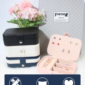 Close-up of portable PU leather jewelry box with multi-color options and functional slots