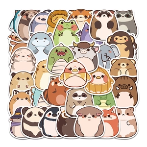 Close-up of cute cartoon plush animal stickers including panda, penguin, and frog on white