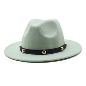 Detailed shot of mint green wool fedora with black ribbed band and gold metal rivets