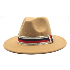 Detail of camel wool fedora hat with red, blue, and white Greek key patterned ribbon