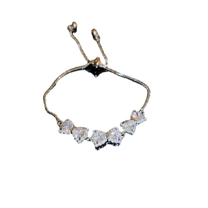Adjustable silver bracelet with sparkling zircon bow accents and pull-chain design