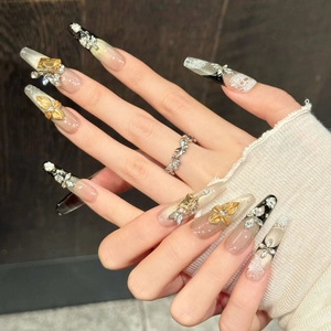 Elegant press-on nails with intricate floral carvings and sparkling zircon accents