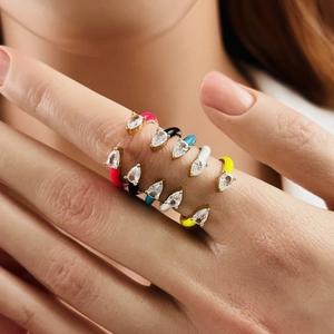 Close-up of colorful enamel water drop rings with micro-set zircon on model fingers