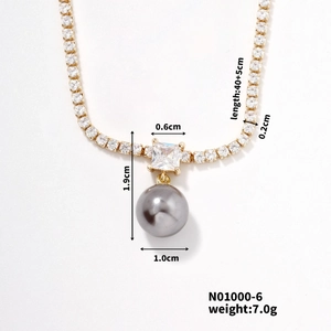 Detailed view of grey pearl and crystal pendant with 40+5cm gold tennis chain specs