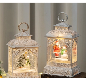 Close-up of vintage white Christmas lanterns with Santa and snowman scenes inside