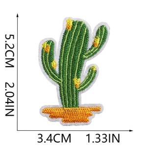 Close-up of cactus embroidery patch with green thread details and white stitched edges