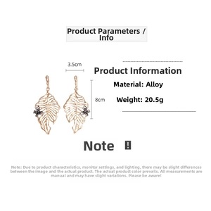 Detailed view of hollow leaf earrings with dark butterfly accents and 8cm dimensions