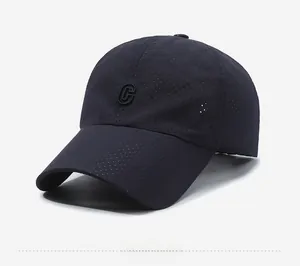 Detailed close-up of dark blue breathable mesh fabric and C letter embroidery on the cap
