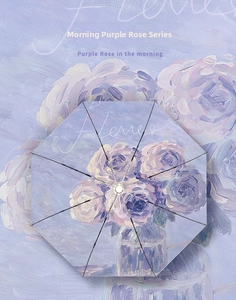 Top view of open purple umbrella with elegant oil painting rose print and 8 ribs