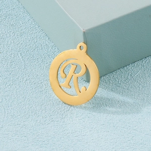 Minimalist gold stainless steel round pendant featuring a hollow cutout letter R design