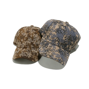 Floral jacquard baseball caps in brown and blue colors with retro botanical patterns