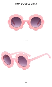 Pink sunflower round sunglasses for kids showing front and side view on white background