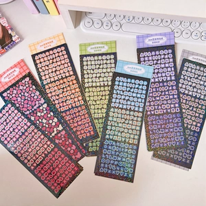 Detailed view of colorful laser glitter heart and letter stickers for card decoration