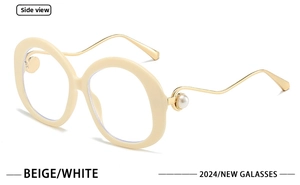 Detailed side view of beige round sunglasses with gold wavy temples and pearl accents