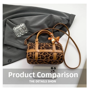 Leopard print Boston bag detail with brown leather handles and decorative silk scarf accessory