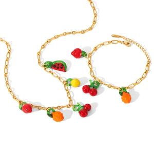 Gold stainless steel jewelry set with colorful enamel fruit charms including cherry and watermelon