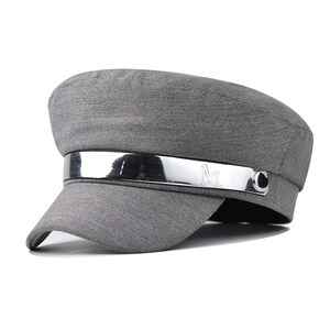 Grey military baker boy hat for women featuring a stylish silver metal M brand bar