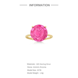 Detail view of S925 sterling silver ring with large round pink zirconia and twisted gold band