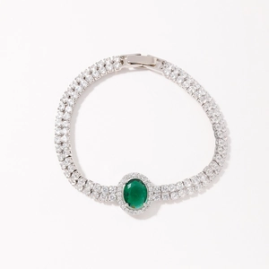 Silver bracelet with large oval emerald green stone and double-row zircon setting