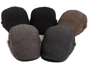 Detailed view of herringbone flat caps in various colors with adjustable metal side buckles