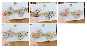 Detail view of butterfly hair clips with colorful crystals and sparkling rhinestones