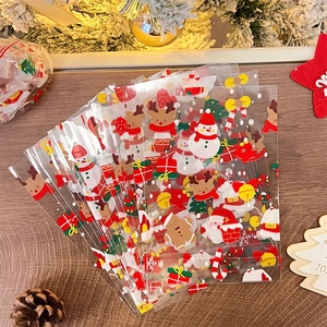 Flat lay of Christmas gift bags with colorful snowman, reindeer and snowflake patterns