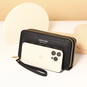 Detail of black PU leather long wallet with double zipper and quilted texture